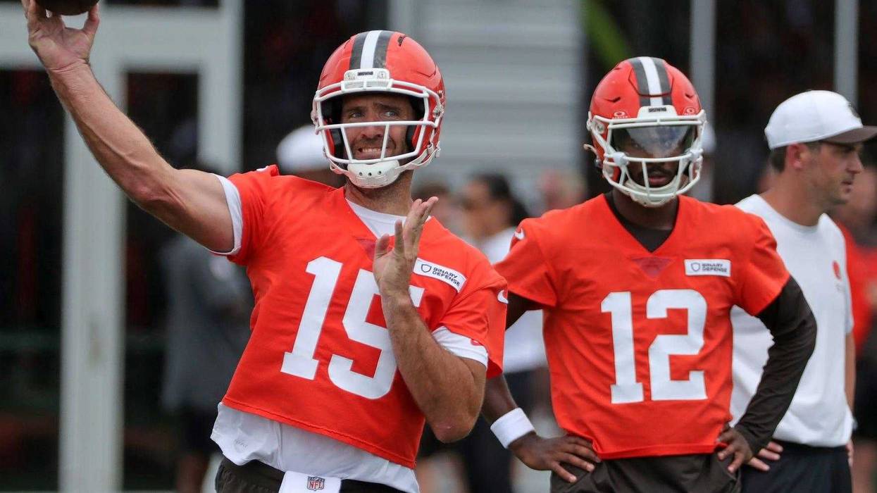 Joe Flacco throws as Shedeur Sanders looks on during Browns training camp July 25, 2025, in Berea, Ohio.