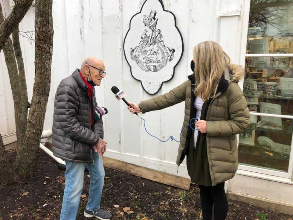 Joe Greenberg, the World War II veteran who worked at The Little Tavern in Geneva for over 50 years doing everything from coordinating inventory, to roaming the store in costumes, to being the staff photographer for special events.