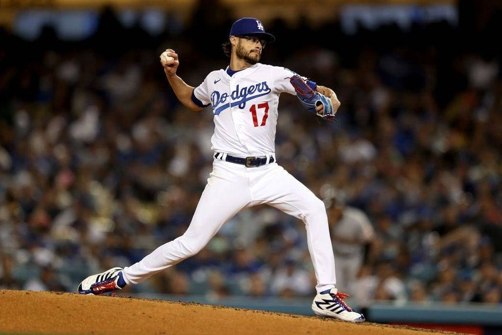 Joe Kelly #17 of the Los Angeles Dodgers pitches against the San Francisco Giants during the fifth inning in game 4.