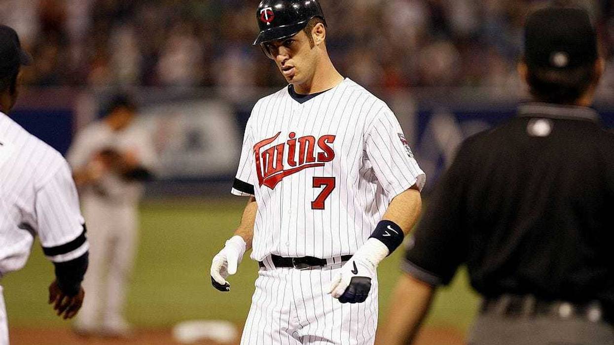 Joe Mauer #7 of the Minnesota Twins stands near first base during the Opening Day game against the Baltimore Orioles on April 2, 2007 at the Metrodome in Minneapolis, Minnesota. The Twins won 7-4.