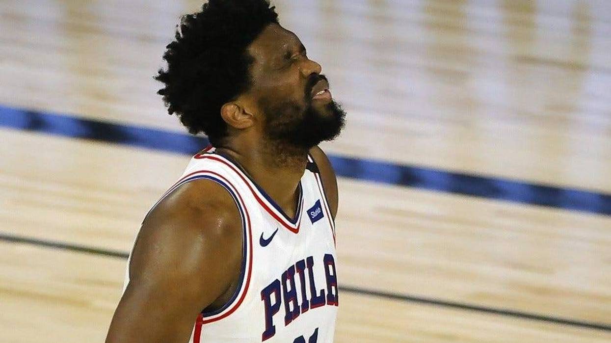 Joel Embiid #21 of the Philadelphia 76ers grimaces after being fouled by the Boston Celtics during the second quarter in game two of the first round of the 2020 NBA Playoffs at The Field House.