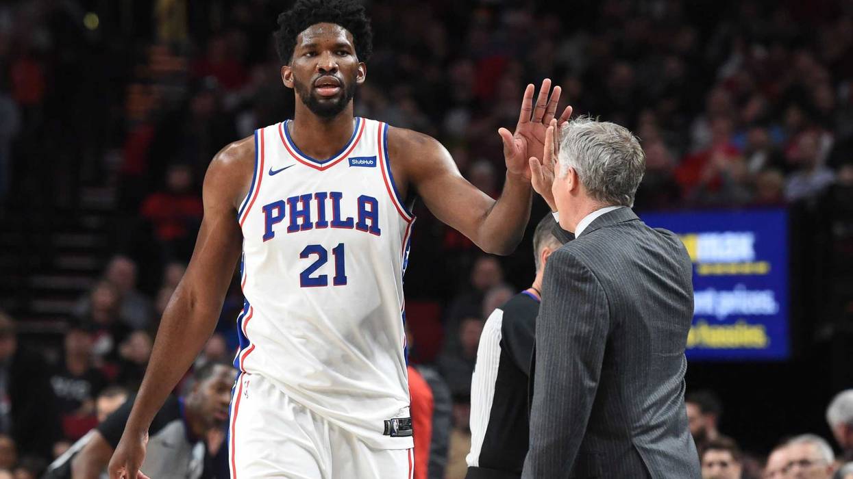 Joel Embiid and Brett Brown