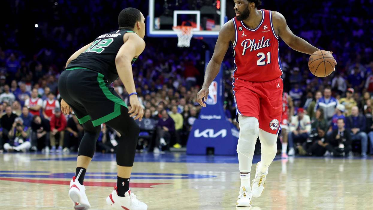 Joel Embiid of the Philadelphia 76ers dribbles against Grant Williams of the Boston Celtics during the fourth quarter in Game 3 of the Eastern Conference Second Round Playoffs at Wells Fargo Center on May 5, 2023, in Philadelphia.