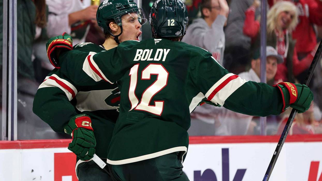 Joel Eriksson Ek #14 of the Minnesota Wild celebrates his goal against the Columbus Blue Jackets with teammate Matt Boldy #12 in the second period of the season opener at Xcel Energy Center on October 10, 2024 in St Paul, Minnesota.