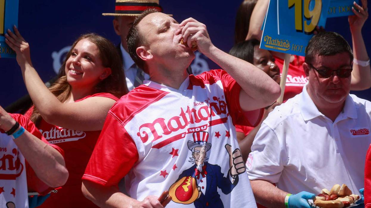 Joey Chestnut eats hot dogs during the 2022 Nathans Famous Fourth of July International Hot Dog Eating Contest on July 4, 2022 at Coney Island in the Brooklyn borough of New York City