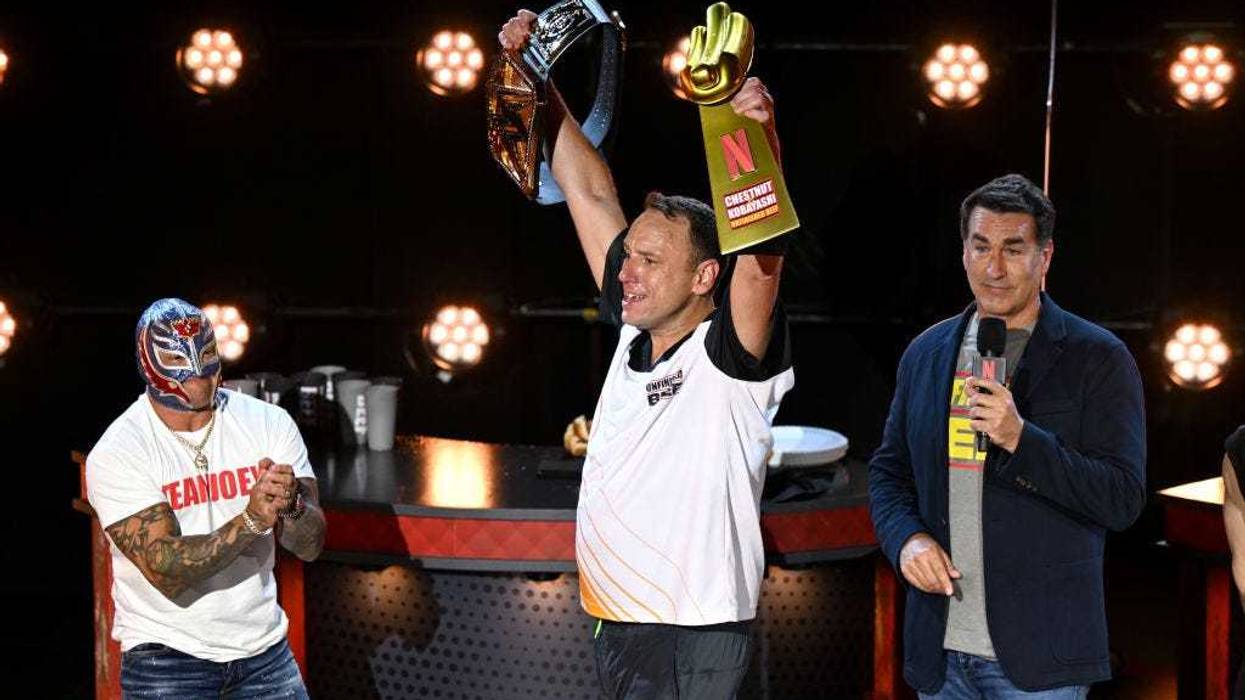 Joey Chestnut, Rey Mysterio and Rob Riggle