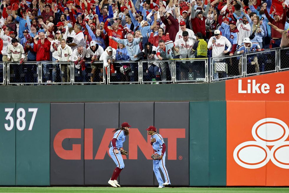 Johan Rojas of the Philadelphia Phillies catches a fly ball in the eighth inning against the Atlanta Braves in Game Four of the Division Series on Thursday.