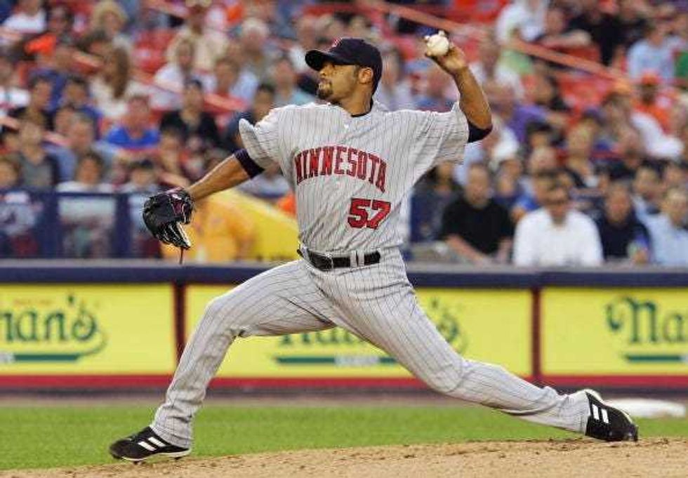 Johan Santana #57 of the Minnesota Twins delivers a pitch against the New York Mets during their interleague game at Shea Stadium June 19, 2007 in the Flushing neighborhood of the Queens borough of New York City.