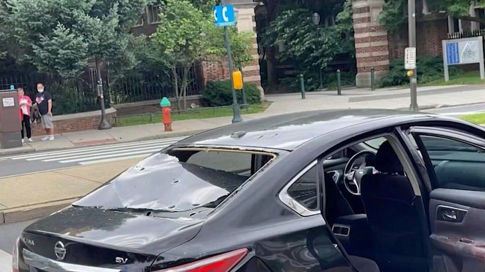 John Albert Laylo and his mother were in this Uber, on their way to Philadelphia International Airport early Saturday morning, when someone in a black car behind them opened fire.