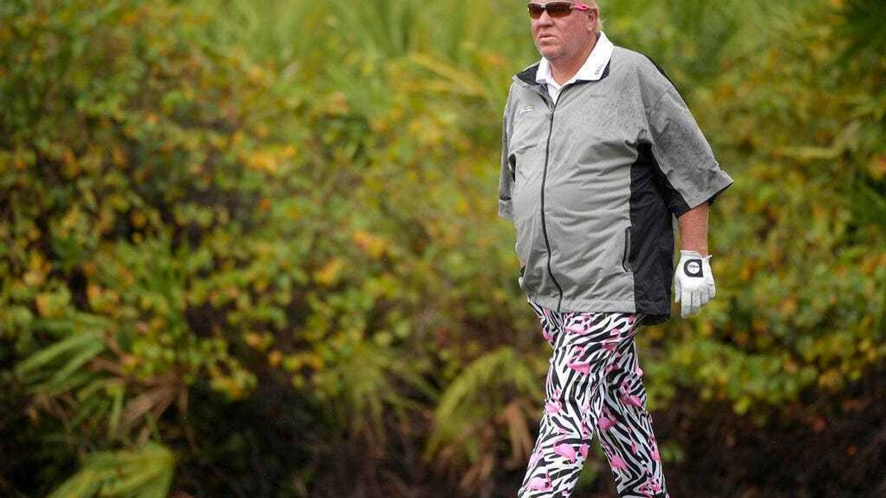 John Daly walks on the ninth green during the first round of the Father Son Challenge golf tournament in Orlando, Fla. The PGA Championship is allowing Daly to use a cart next week at Bethpage Black. It will be the first time since Casey Martin in the U.