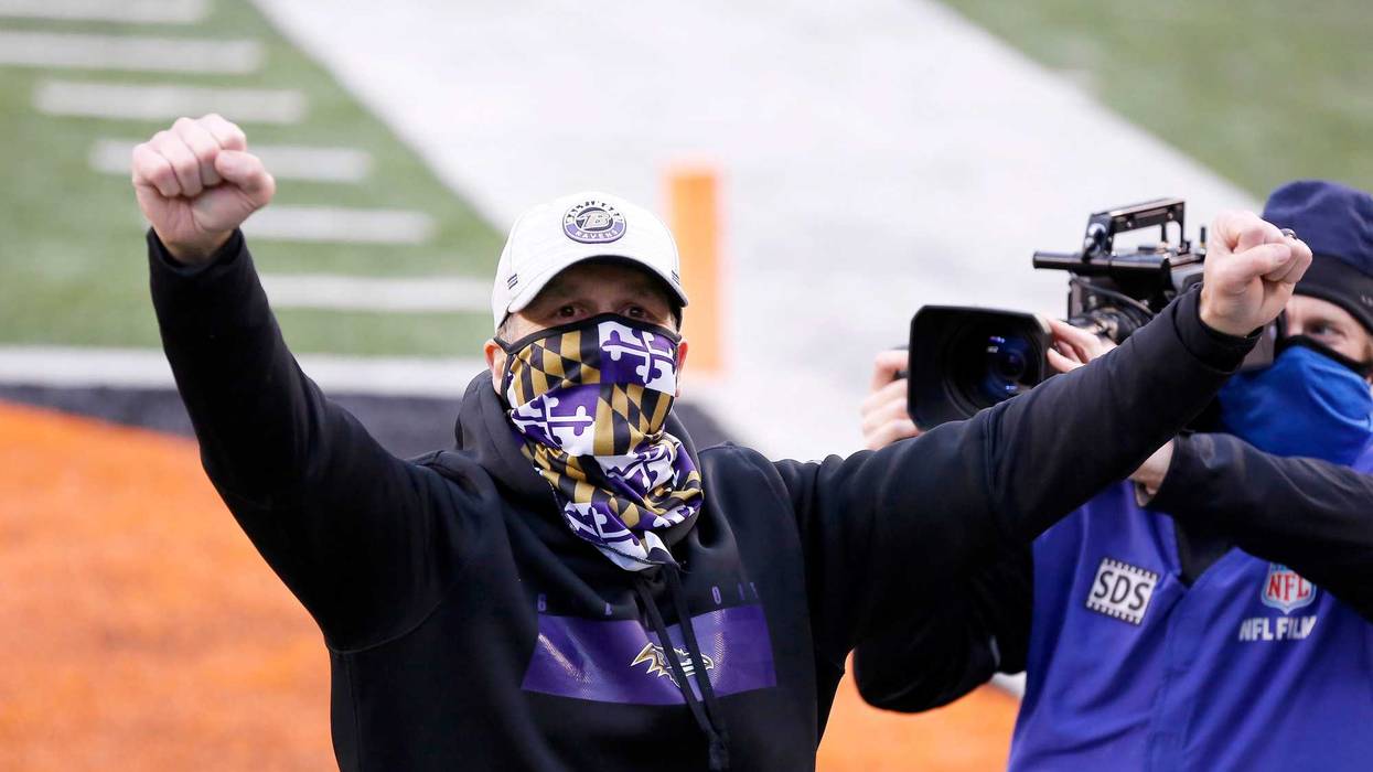John Harbaugh celebrates the Ravens 38-3 victory over the Cincinnati Bengals.