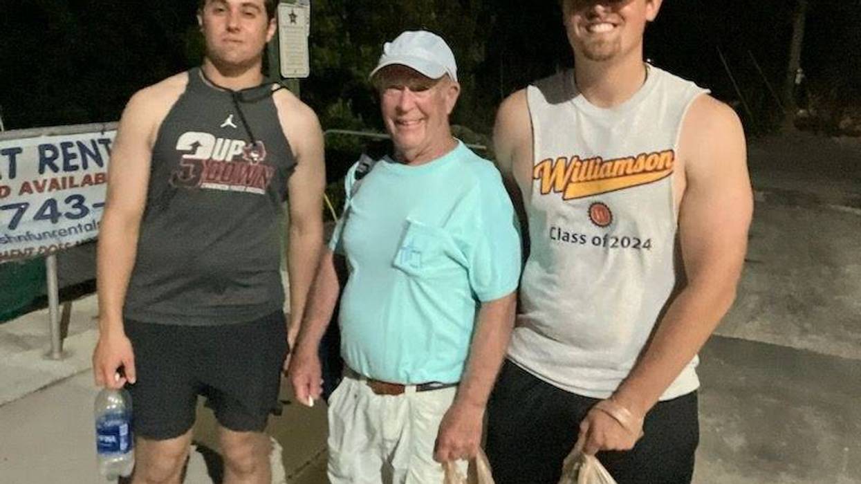 John Hunter (center) with two of his grandsons.