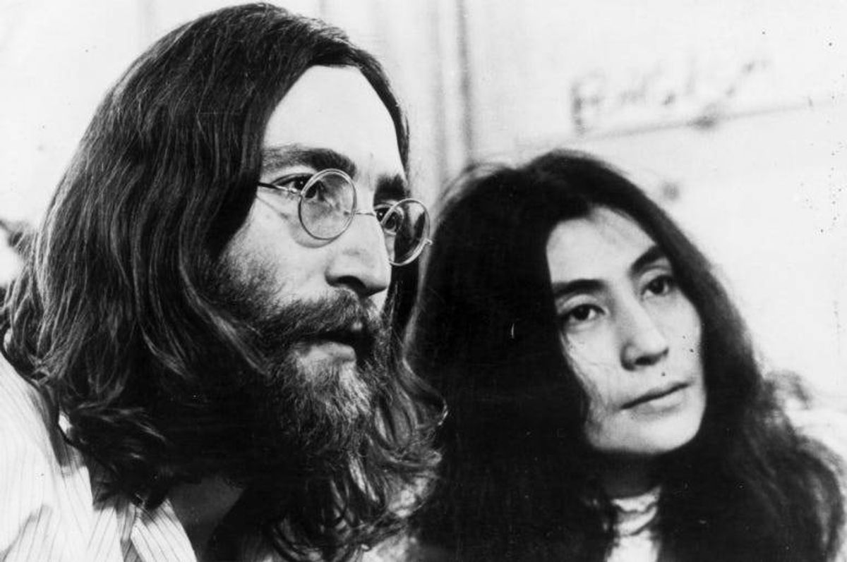 John Lennon and Yoko Ono listening to the playback of one of their tapes.