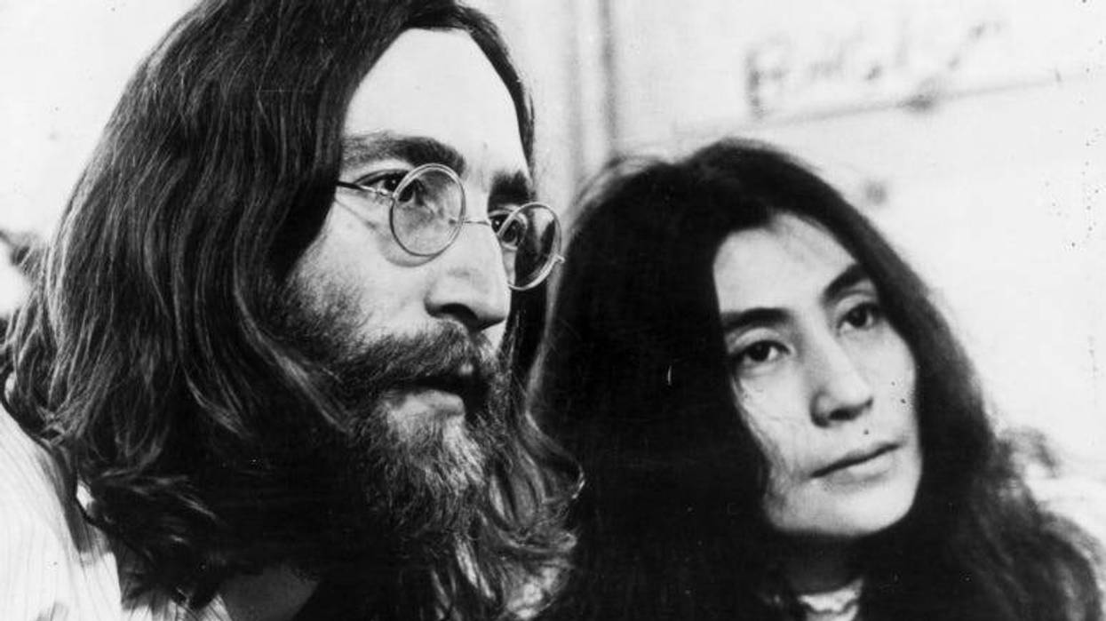 John Lennon and Yoko Ono listening to the playback of one of their tapes.