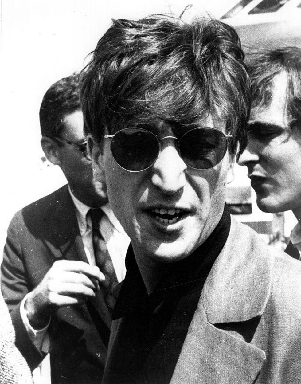 John Lennon wearing round sunglasses