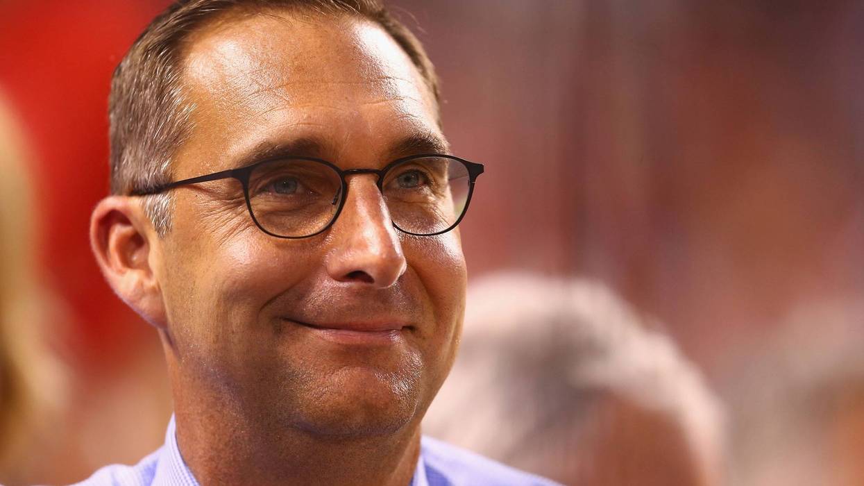 john mozeliak close up. he's a white man w brown hair and thin black glasses