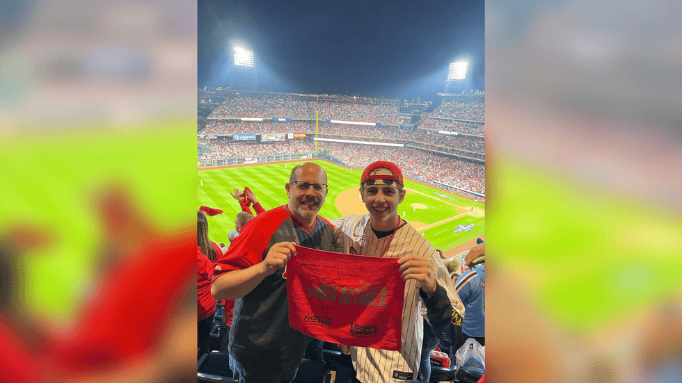 John Nolan III and John Nolan Jr. at Game 4 of the 2022 NLCS.