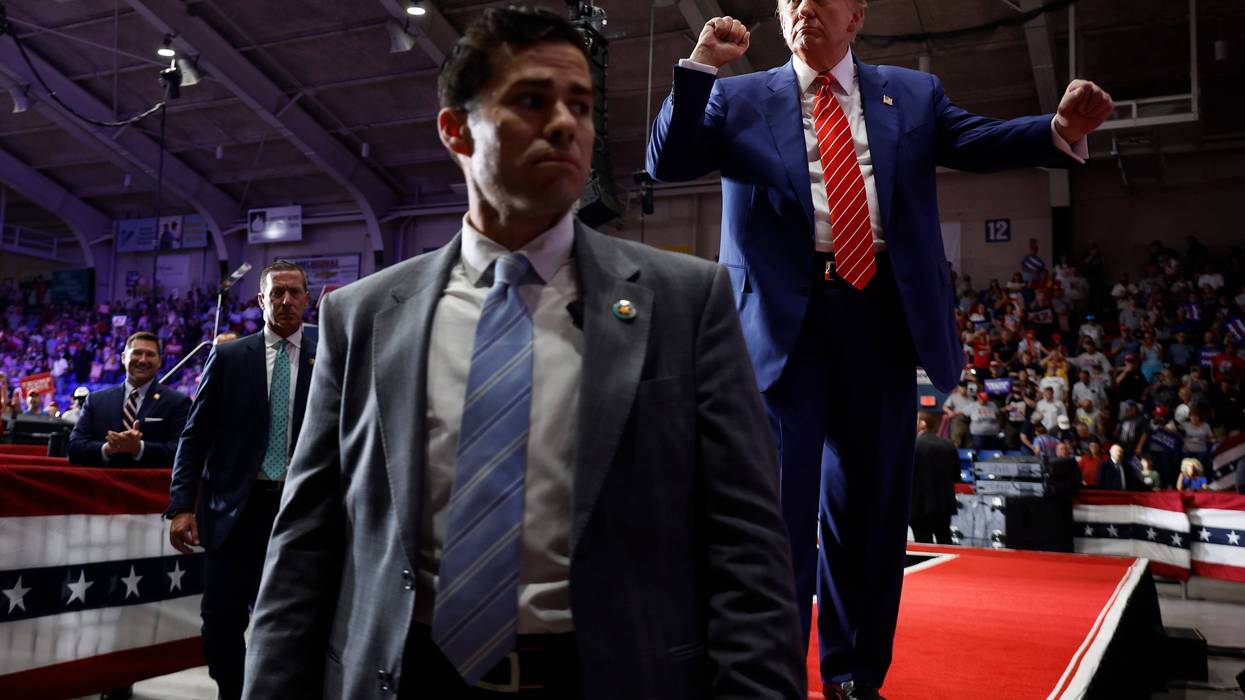 JOHNSTOWN, PENNSYLVANIA - AUGUST 30: Surrounded by U.S. Secret Service agents, Republican presidential nominee, former U.S. President Donald Trump dances his way off stage in the 1st Summit Arena at the Cambria County War Memorial on August 30, 2024 in Johnstown, Pennsylvania. Promising to cut energy bills in half, conduct the largest deportation operation in history and put a 200% tariff on foreign made automobiles, Trump rallied his supporters in the all-important battleground state of Pennsylvania. (Photo by Chip Somodevilla/Getty Images)