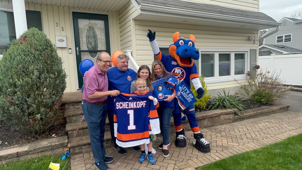 Jon Ledecky and Sparky surprise the Scheinkopf family.