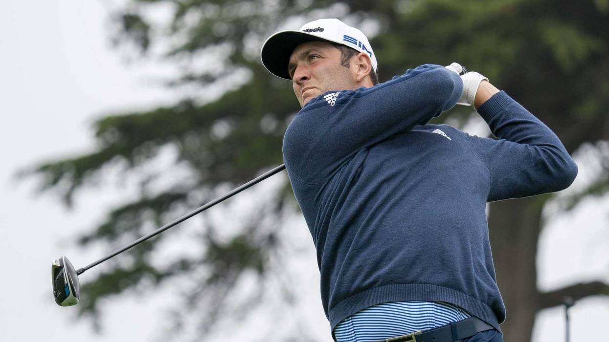 Jon Rahm hits his tee shot on the first hole during a practice round of the PGA Championship golf tournament at TPC Harding Park.