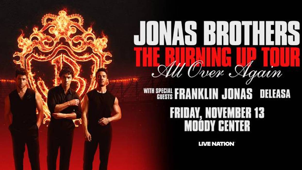 Jonas Brothers 'Burning Up Tour' poster with band members and fiery JB logo.