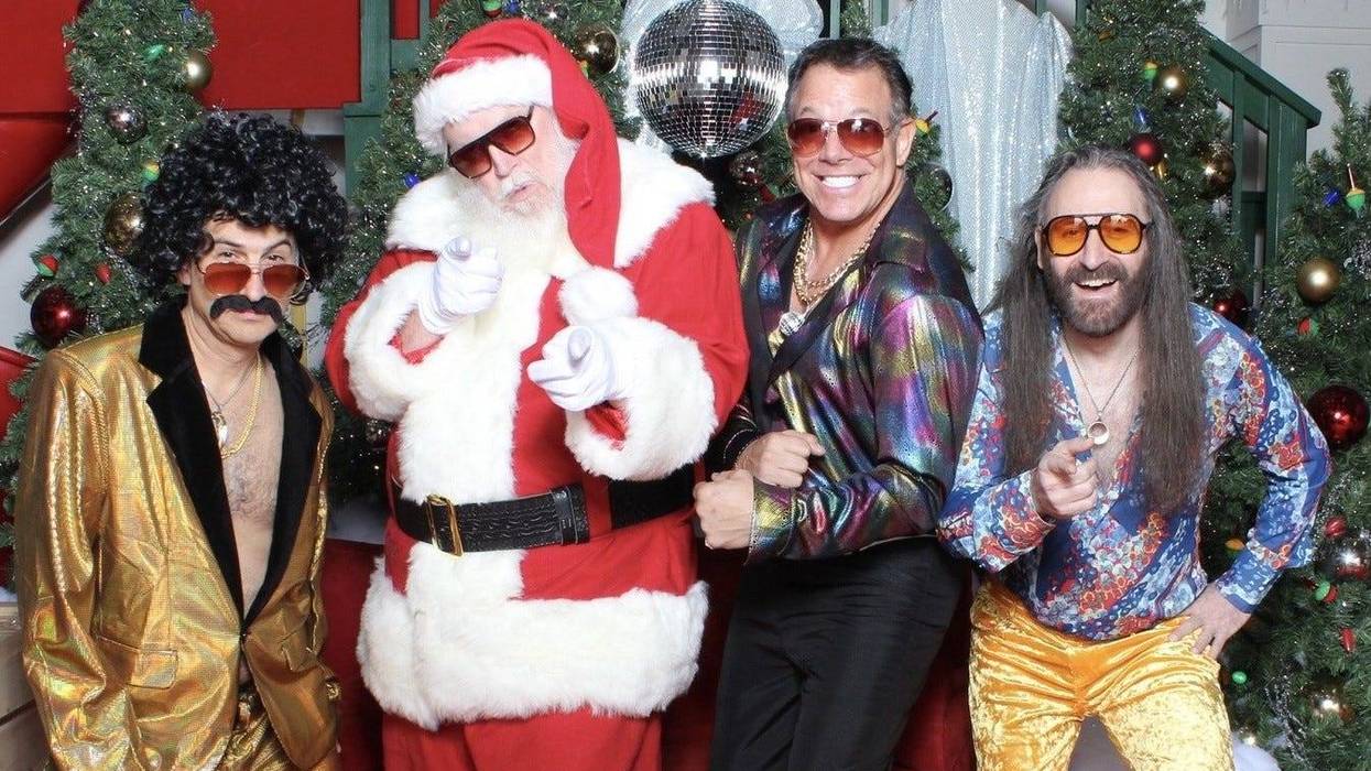 Jonathan in gold disco suit with Santa and other glam friends