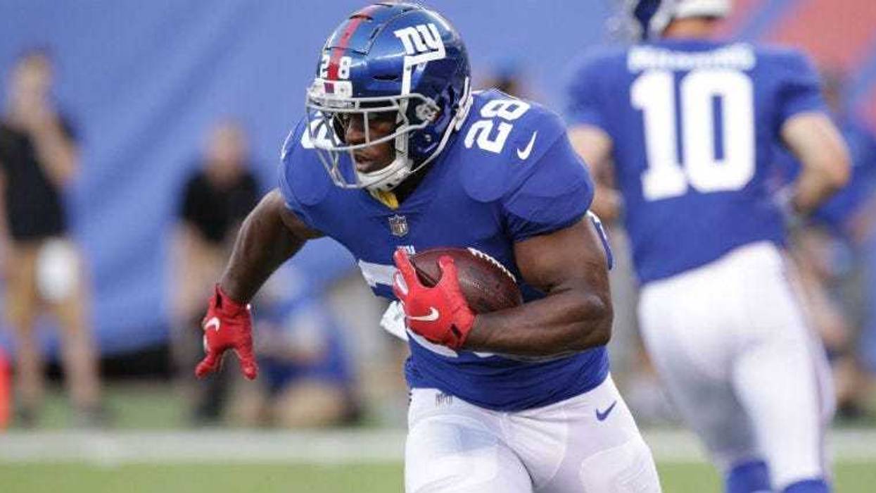 Jonathan Stewart carries the ball against the Cleveland Browns at MetLife Stadium.