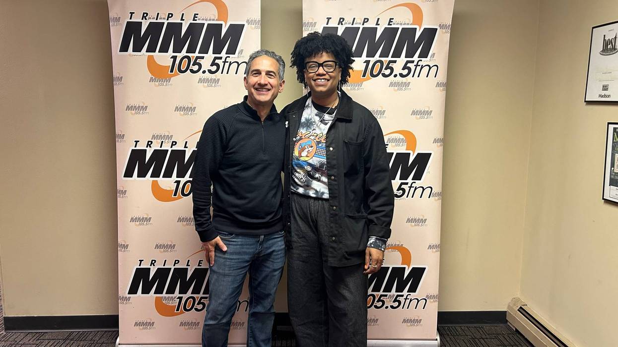 Jonathan Suttin with Amythyst Kiah in front of WMMM banner