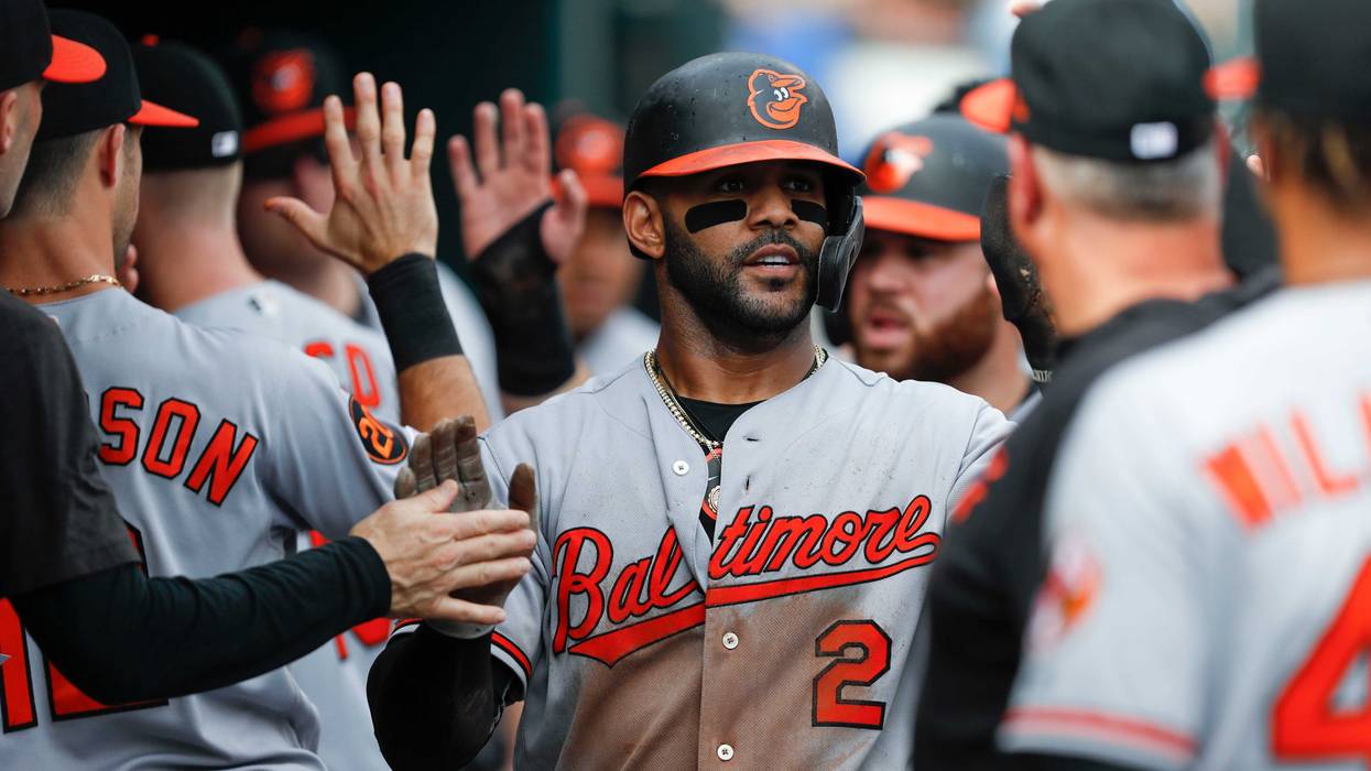 Jonathan Villar high-fives his Oriole teammates