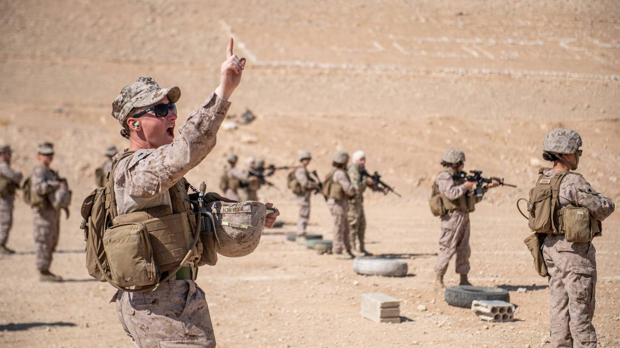 JORDAN (Aug. 1, 2019) Cpl. Riley Guidi, assigned to the 11th Marine Expeditionary Unit (MEU) Female Engagement Team, gives the course of fire to Marines and members of the Jordan Armed Forces Quick Reaction Force Female Engagement Team during a live-fire
