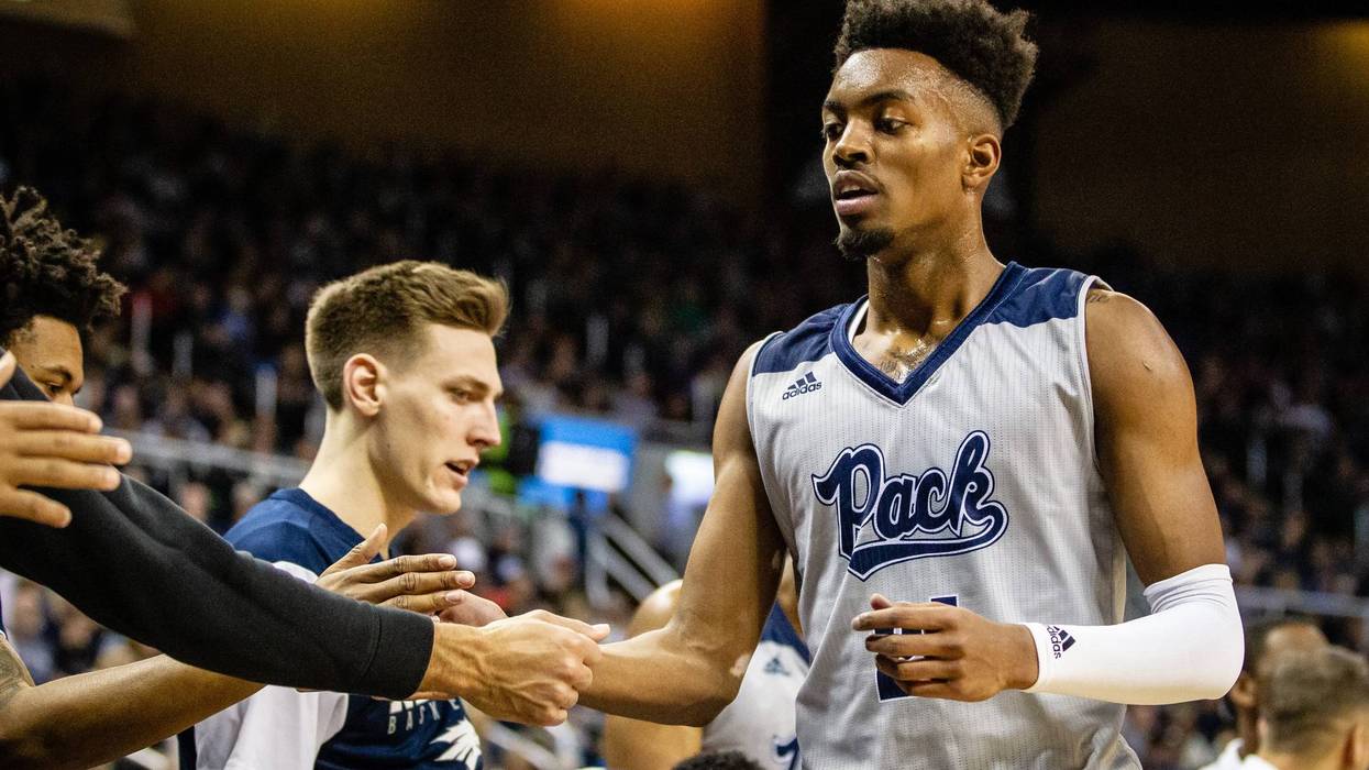 Jordan Brown #21 of the Nevada Wolf Pack slaps hands with teammates as he comes off the court during the game between the Nevada Wolf Pack and the Boise State Broncos at Lawlor Events Center on February 02, 2019 in Reno, Nevada.