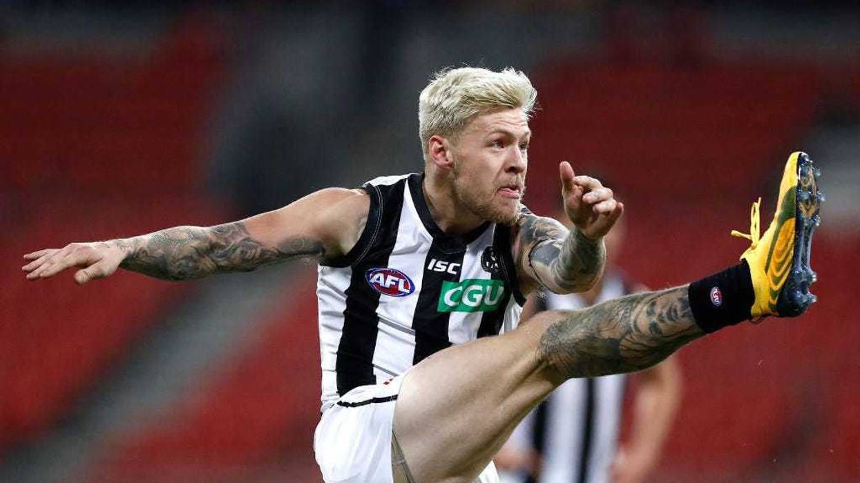 Jordan De Goey of the Magpies kicks during the round 4 AFL match between Greater Western Sydney Giants and Collingwood Magpies at GIANTS Stadium on June 26, 2020 in Sydney, Australia.