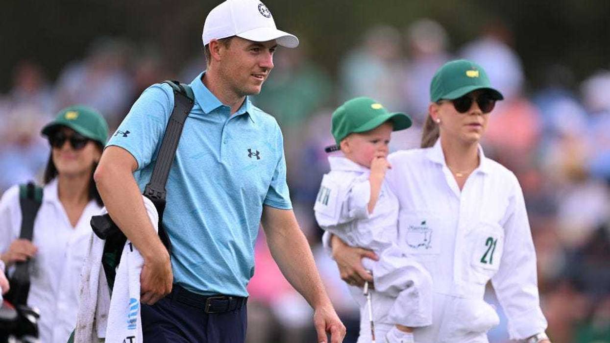 Jordan Spieth of the United States looks on with his wife, Annie Verret Spieth and son, Sammy Spieth walk off the first hole during the Par 3 contest prior to the 2023 Masters Tournament at Augusta National Golf Club on April 05, 2023 in Augusta, Georgia.