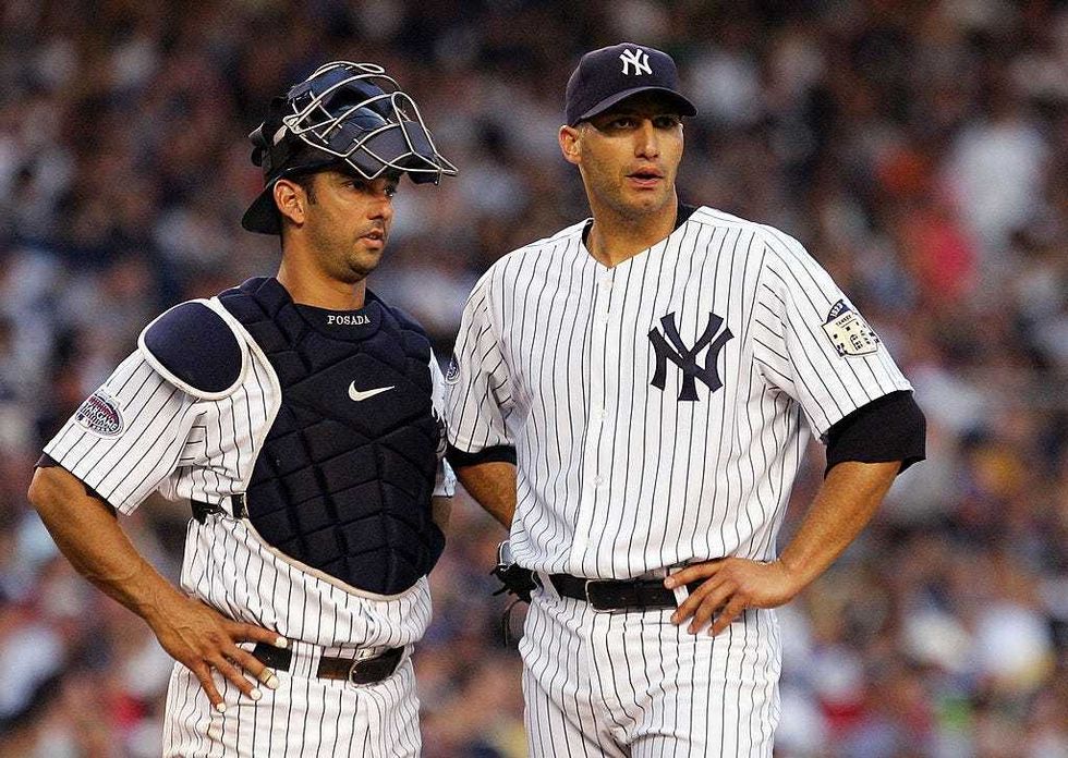 Jorge Posada and Andy Pettitte talk things over during a game.