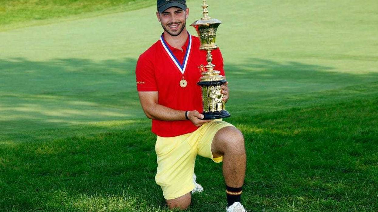Jose Luis Ballester of Spain poses with the trophy after the 36-Hole Championship Match of the U.S. Amateur Championship at Hazeltine National Golf Club on August 18, 2024 in Chaska, Minnesota.