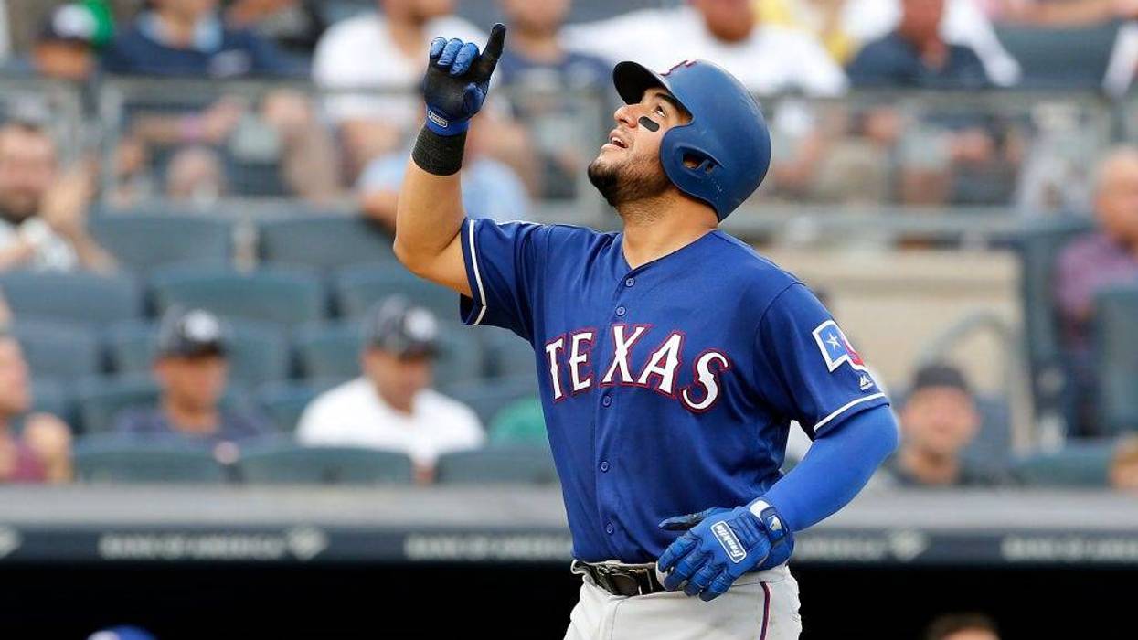 Jose Trevino #56 of the Texas Rangers celebrates as he runs the bases after his fifth inning home run against the New York Yankees at Yankee Stadium on September 02, 2019 in New York City.