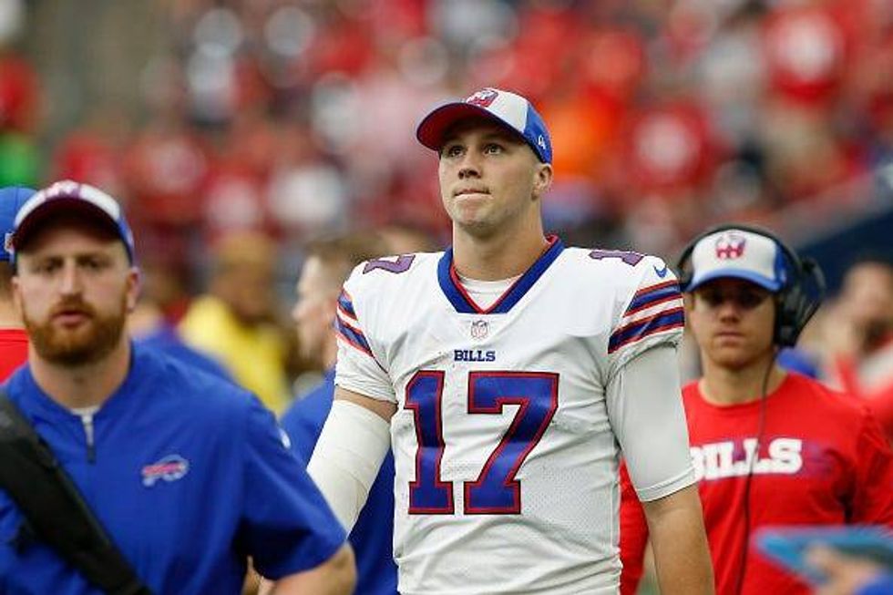 Josh Allen looks up from the Bills sideline.