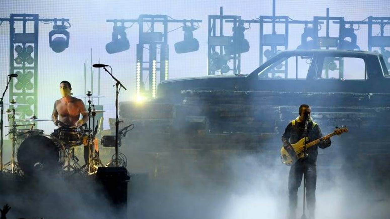 Josh Dun (L) and Tyler Joseph of Twenty One Pilots perform onstage during the 2018 American Music Awards