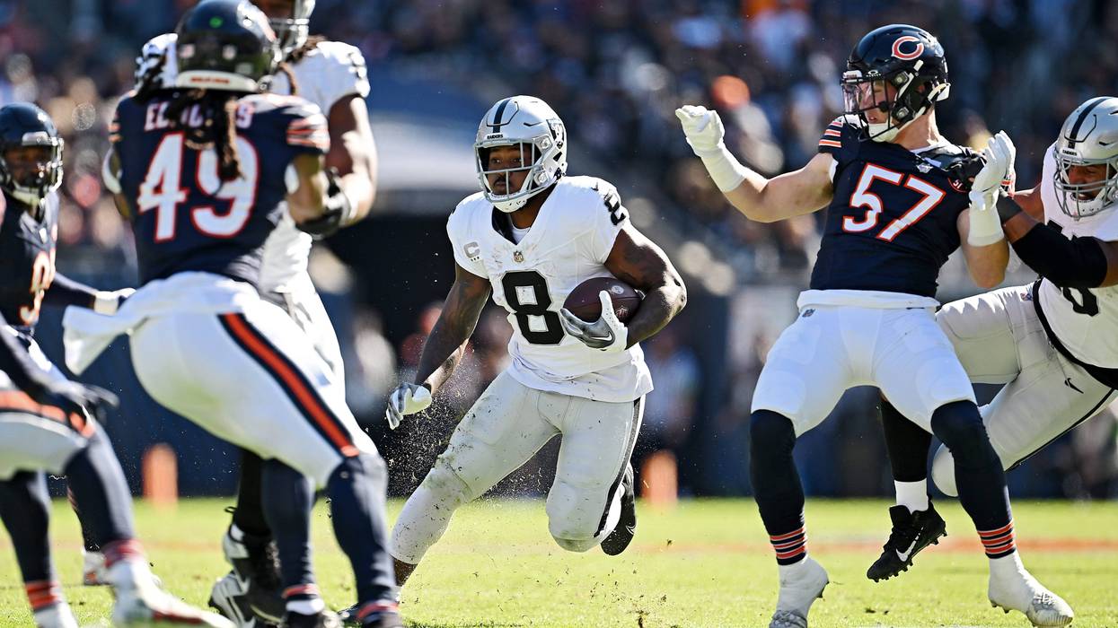 Josh Jacobs #8 of the Las Vegas Raiders runs with the ball during the second quarter against the Chicago Bears at Soldier Field on October 22, 2023 in Chicago, Illinois.
