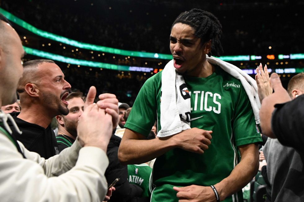 Josh Minott #8 of the Boston Celtics reacts as he walks off of the court after a game against the Los Angeles Lakers at the TD Garden on December 05, 2025 in Boston, Massachusetts.