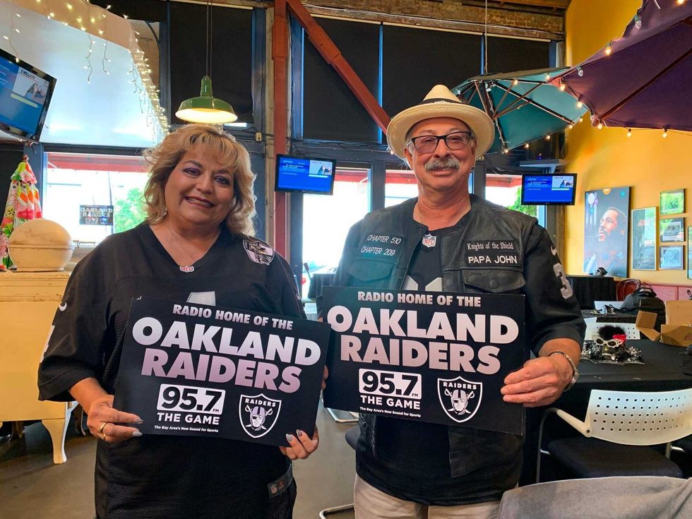 JP and Cakes from The Sports Junkies as well as 106.7 The Fan Street Team, chats with Skins fans at Glory Days Grill in Centreville, Va before kickoff.