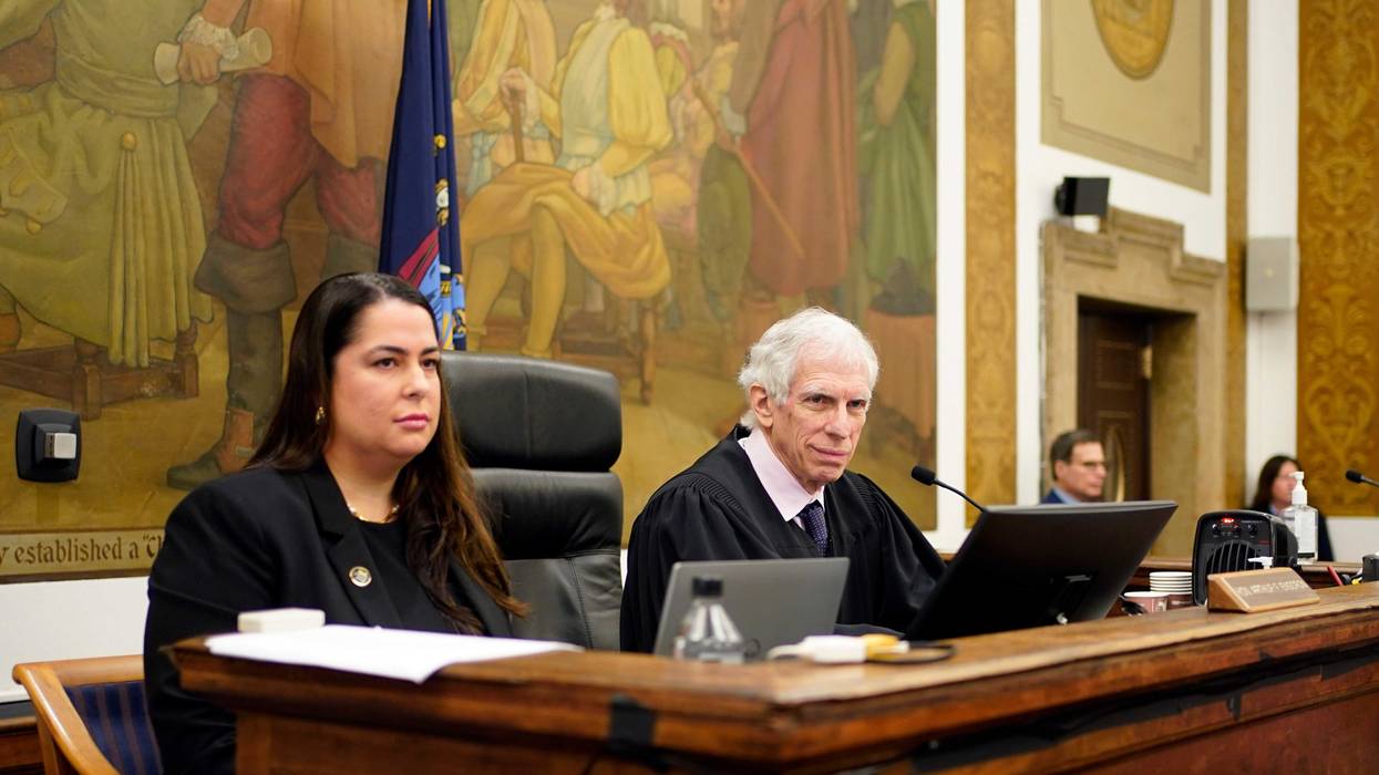 Judge Arthur Engoron (R) and principal law clerk Allison Greenfield (L) sit on the bench during Donald Trump's civil business fraud trial at New York Supreme Court, Oct. 17, 2023, in New York.