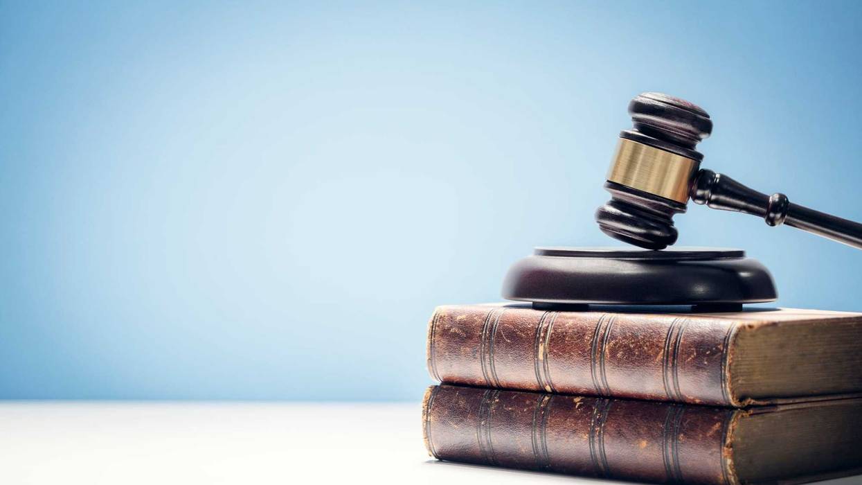 Judge gavel and law books in court.