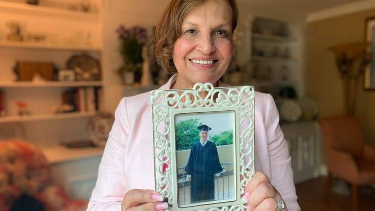 Judi Reiss holds a graduation photo of her son Josh, who was killed in the 9/11 attack on the World Trade Center.