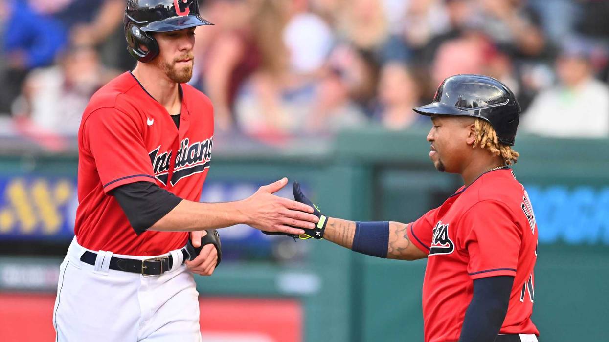 Jul 10, 2021; Cleveland, Ohio, USA; Cleveland Indians center fielder Bradley Zimmer (4) celebrates with third baseman Jose Ramirez (11) after scoring against the Kansas City Royals during the sixth inning at Progressive Field.