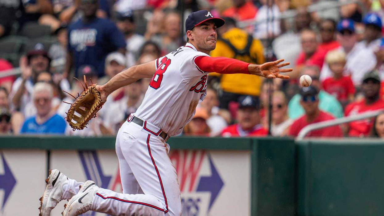Jul 10, 2022; Cumberland, Georgia, USA; Atlanta Braves first baseman Matt Olson (28) flips the ball to starting pitcher Ian Anderson (36) (not shown) for an out against the Washington Nationals during the second inning at Truist Park.