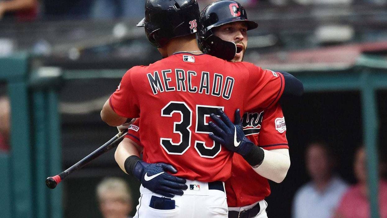 Jul 19, 2019; Cleveland, OH, USA; Cleveland Indians right fielder Tyler Naquin (30) celebrates with center fielder Oscar Mercado (35) after hitting a home run during the third inning against the Kansas City Royals at Progressive Field. Mandatory Credit: K