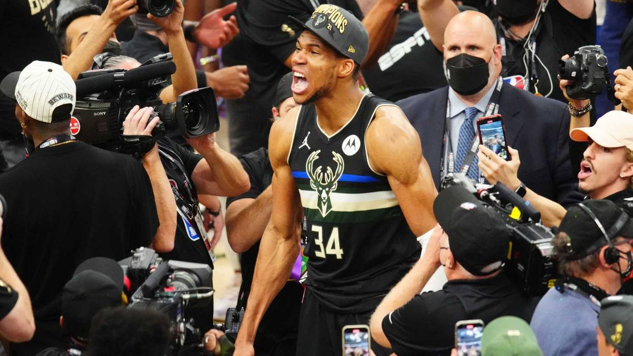 Jul 20, 2021; Milwaukee, Wisconsin, USA; Milwaukee Bucks forward Giannis Antetokounmpo (34) celebrates after winning game six of the 2021 NBA Finals and the championship against the Phoenix Suns at Fiserv Forum. Mandatory Credit: Mark J. Rebilas-USA TODAY Sports