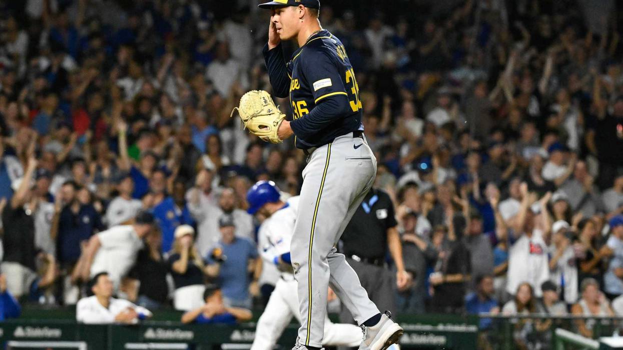 Jul 22, 2024; Chicago, Illinois, USA; Milwaukee Brewers pitcher Tobias Myers (36) wipes his face after Chicago Cubs outfielder Ian Happ (8) hits a home run during the sixth inning at Wrigley Field. Mandatory Credit: Matt Marton-USA TODAY Sports