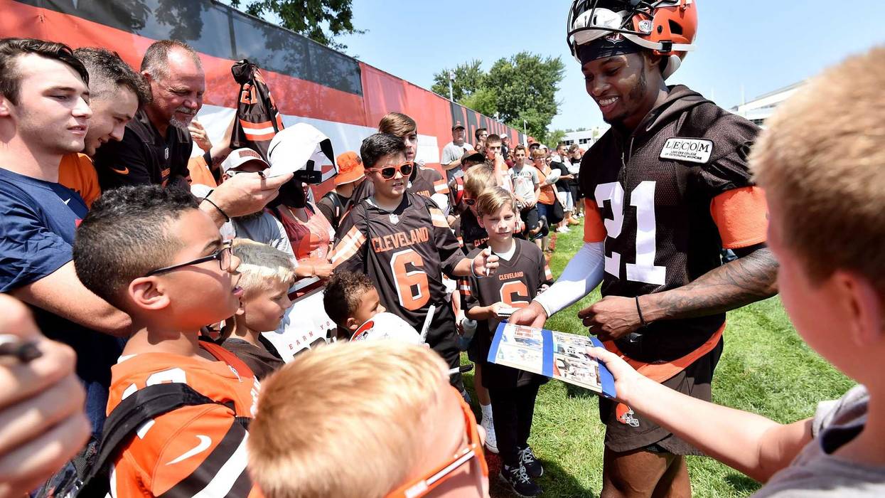 Jul 25, 2019; Berea, OH, USA; Cleveland Browns cornerback Denzel Ward (21) signs autographs after training camp at the Cleveland Browns Training Complex. Mandatory Credit: Ken Blaze-USA TODAY Sports